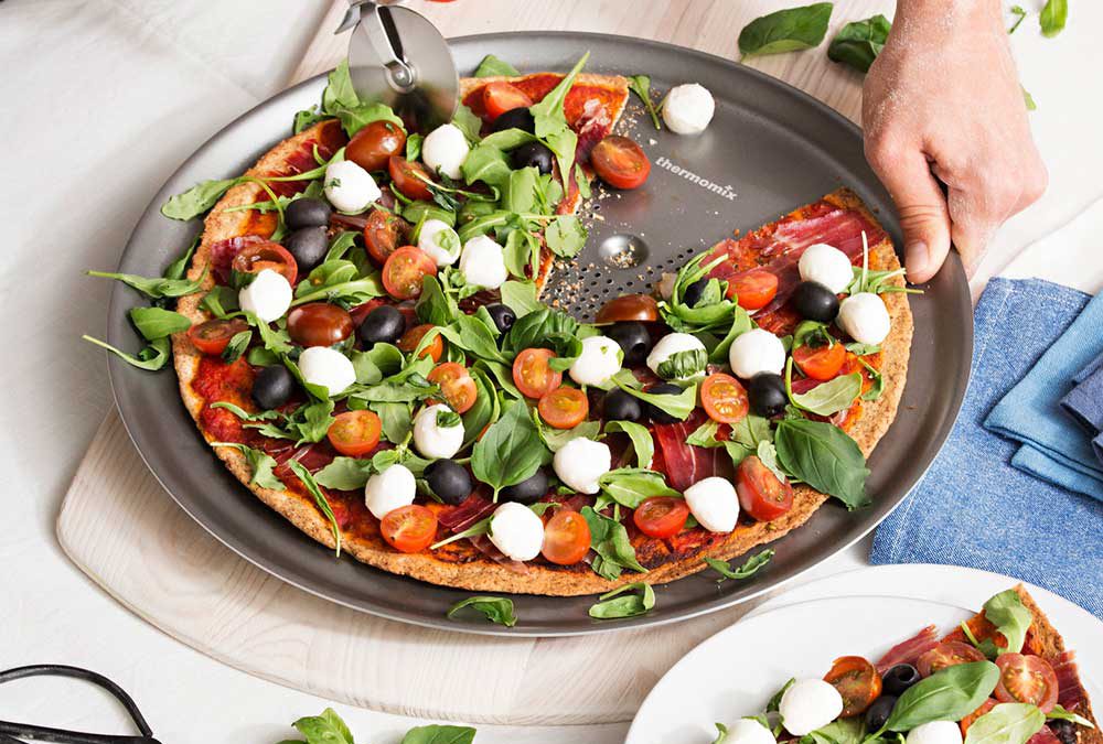 PIZZA INTEGRAL CON TOMATES CHERRY, RÚCULA Y MOZZARELLA FRESCA